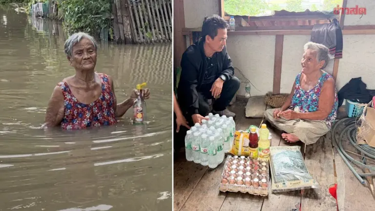 District Aids Elderly Woman Walking Flood Waters for Fish Sauce