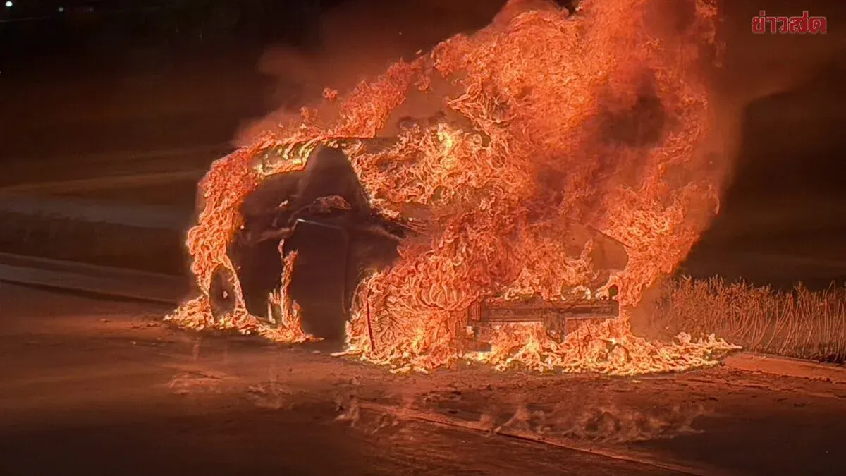 Electric Vehicle Engulfed in Flames on Flooded Bangkok Road